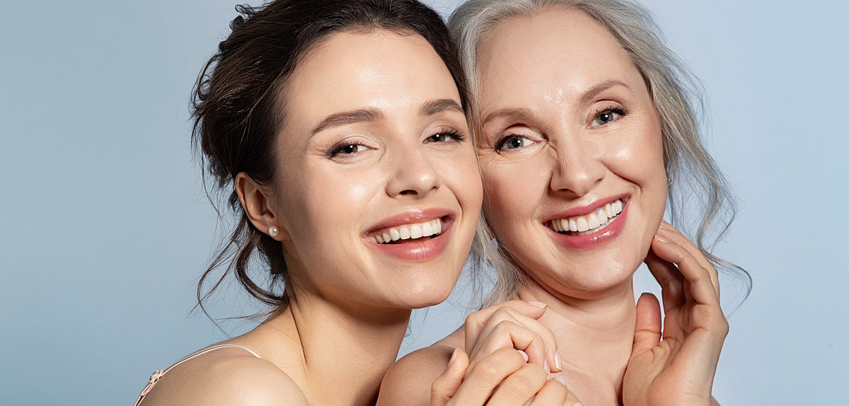 Younger woman and older woman with silver hair smiling together – what happens when you stop retinol