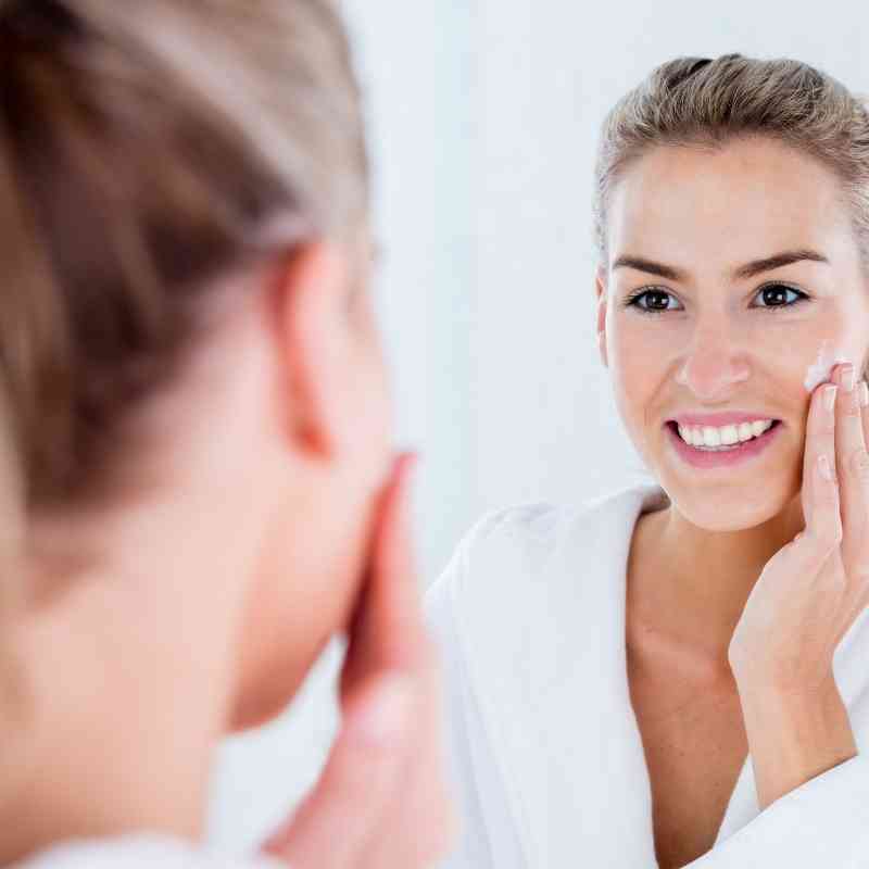 Beautiful women with hydrated glowing skin after using skincare products