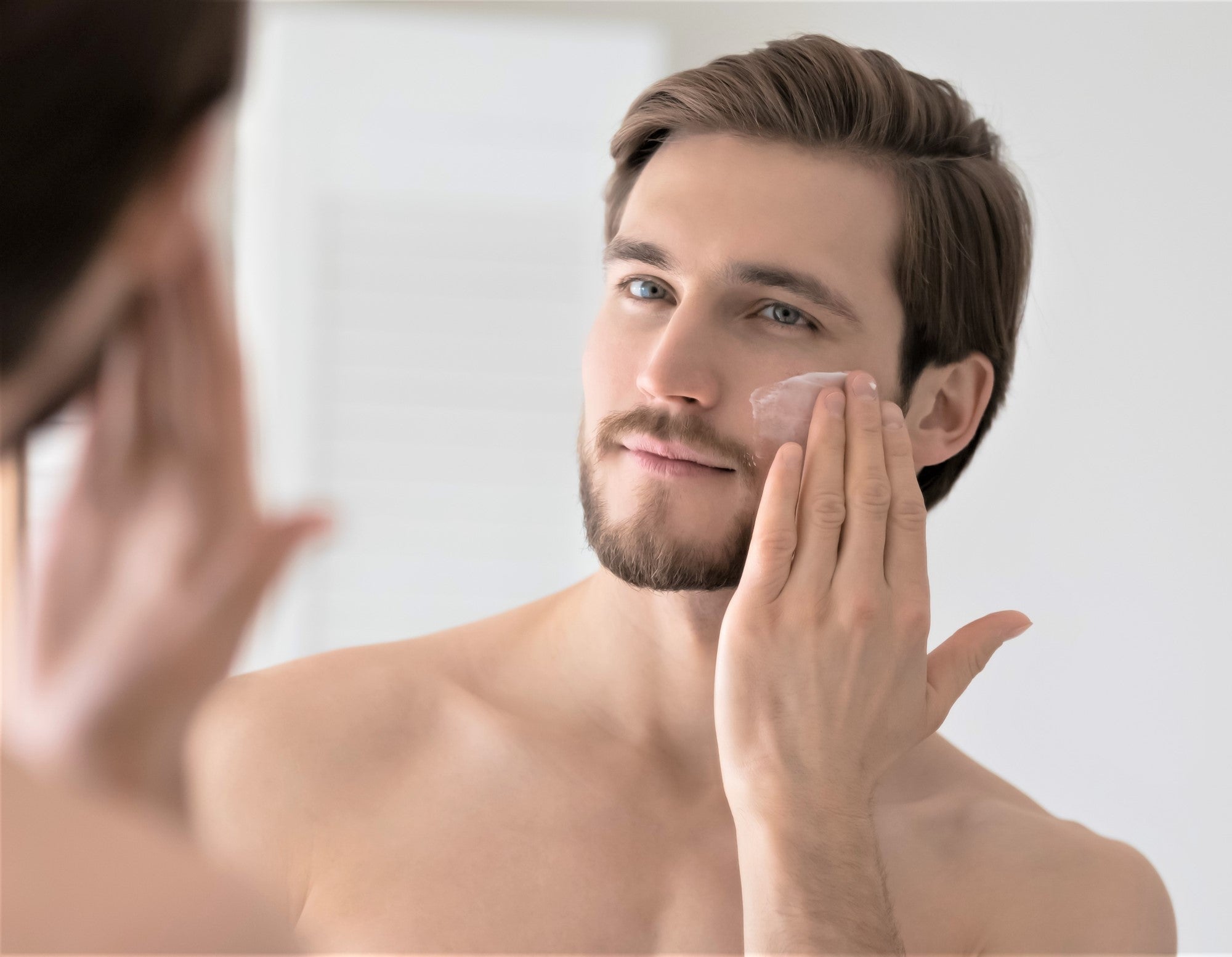 A man applies Dermaworks expert daily moisturiser for men to his face. Our anti-aging face cream for men helps to hydrate, brighten and reduce the appearance of wrinkles.