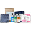 Complete skincare kit featuring a face cloth, trio set of hydrating serums or moisturizers, and nourishing face cream for cleansing and moisturizing skin.